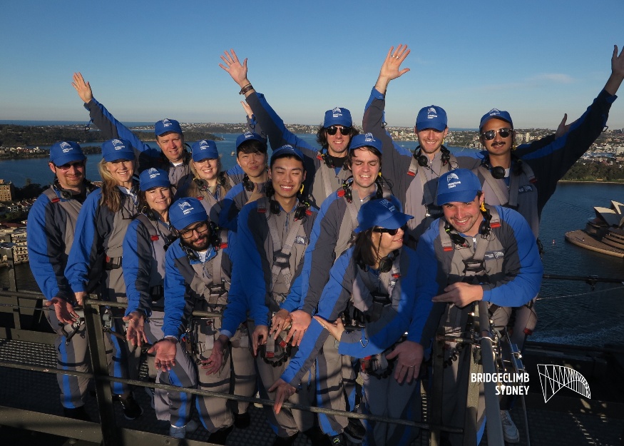 Graduates on the of the Sydney Harbour bridge.